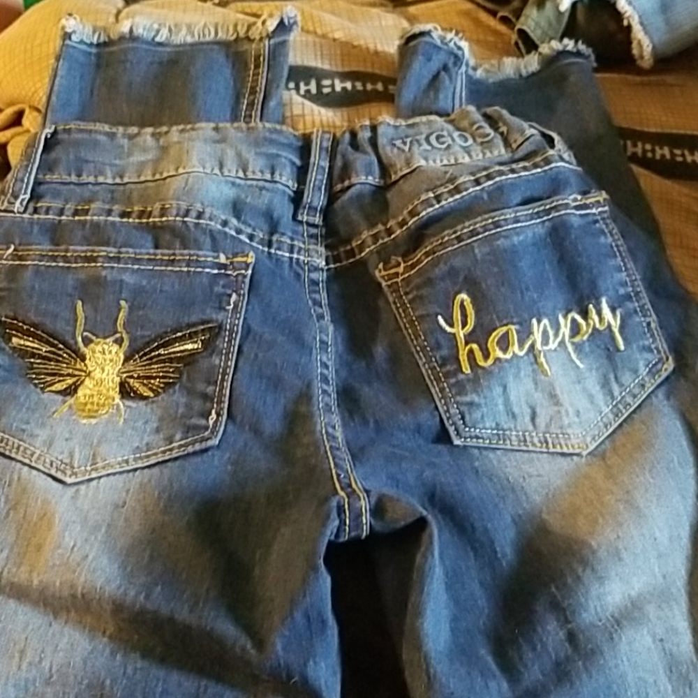 Girls size 8 jeans with detail on back pockets